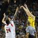 Michigan freshman Nik Stauskas shoots a three-point basket in the first half against Louisville at the Georgia Dome during the national championship game in Atlanta on Monday, April 8, 2013. Melanie Maxwell I AnnArbor.com